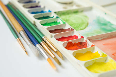 Selective focus of Colorful Watercolor palette on a white backgroundの写真素材