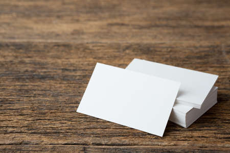 Stack of Business card on wood background and copy spaceの写真素材