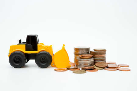 Model loader, coins stack on white background for money saving conceptの写真素材