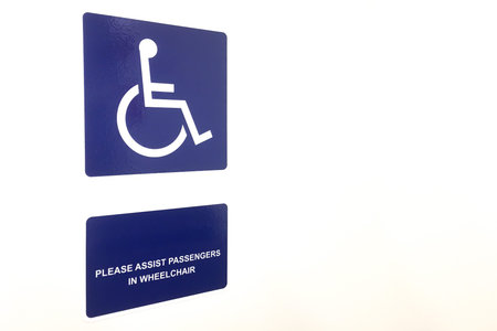 Signs and messages Please assist passengers in wheel chair in public transportation on white...