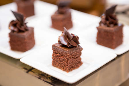 Selective focus of Many chocolate cakes on the shelvesの写真素材