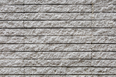 Pattern of the white stone wall texture background