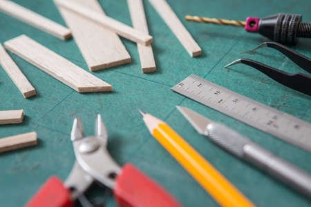 Selective focus of Many DIY equipment on a green cutting mat and copy space for do it yourself conceptの写真素材