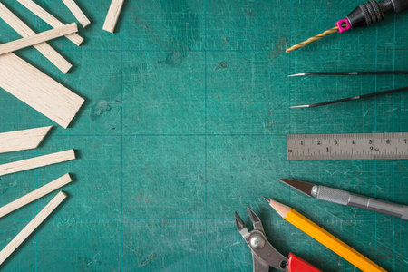 Top view of Many DIY equipment on a green cutting mat and copy space for do it yourself concept