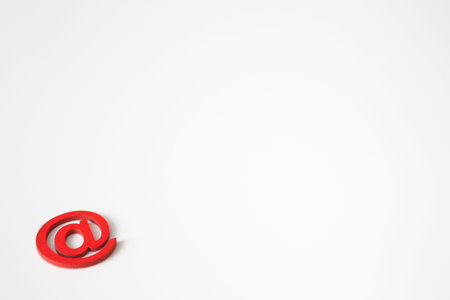 Red wooden symbol at on white background and copy space for social media educational concept