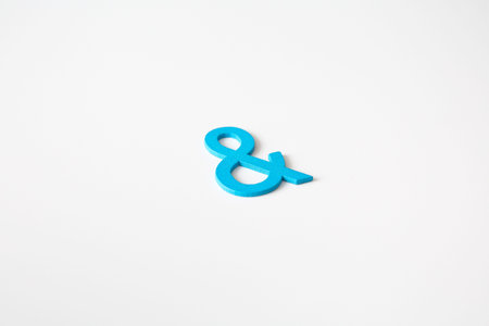 Blue wooden symbol and on white background and copy space for social media educational concept