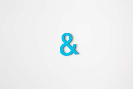 Blue wooden symbol "and" on white background and copy space for social media educational conceptの写真素材