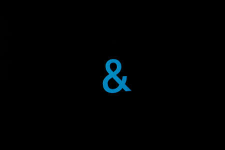 Blue wooden symbol "and" on black background and copy space for social media educational conceptの写真素材