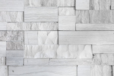 Pattern of the white stone wall texture background.