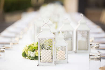 Selective focus of Tableware decorations with white tablecloths at outdoor wedding.の写真素材