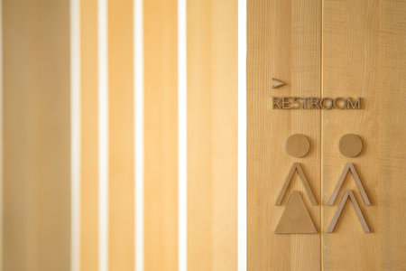 Restroom icon on wooden background and copy space.の写真素材
