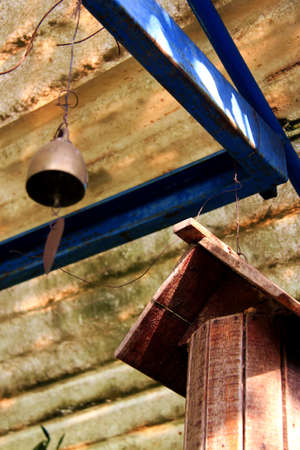 Wooden house bird and bellの写真素材