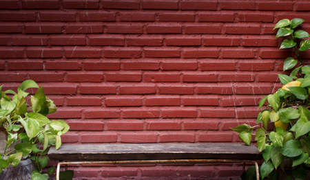 Wooden chair on a brick wallの写真素材
