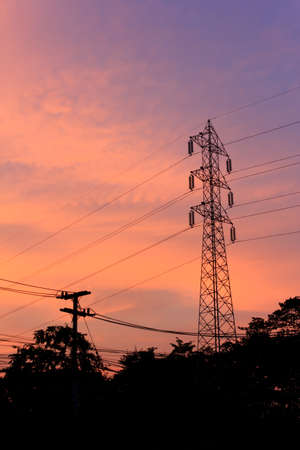 Electricity pylons at sunsetの写真素材