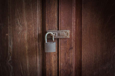 Old key on the old door の写真素材