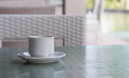 White cup of coffee on tableの写真素材