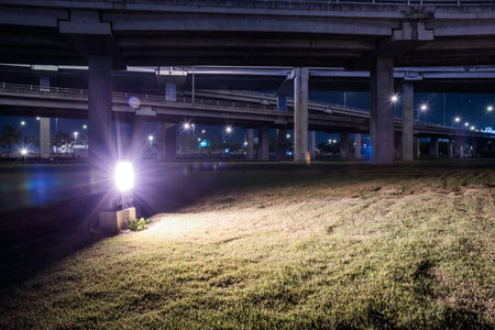 tollway express road with grass lawn in night scene