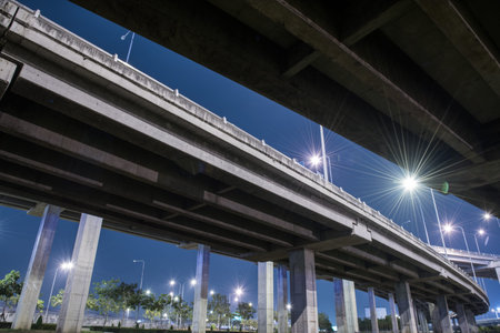 tollway express road with grass lawn in night scene