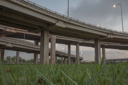 landscape tollway express road with grass lawn in night sceneの写真素材