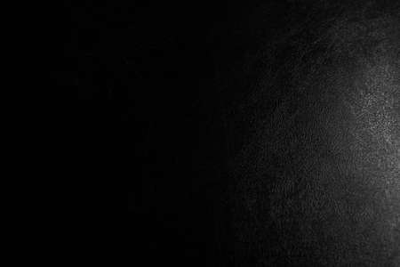 synthesis pvc leather black condition scratched and dust  light with illuminated in studioの写真素材