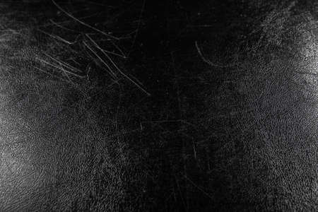 synthesis pvc leather black condition scratched and dust  light with illuminated in studioの写真素材