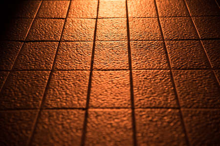 abstract of sunlight reflect on clay tile floor in corridoor of buildingの写真素材