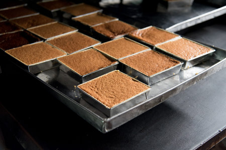 fresh from oven of very delicious and famous thai custard in factory . egg , palm sugar and taro...