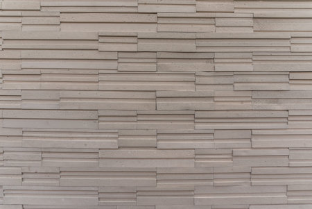 random stack pattern creamtone sandstone  texture backgroundの写真素材