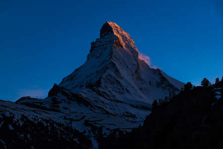 Very beautiful nature of  Matterhorn mountain , Switzerland Alps view from Zermatt at twilight time with golden light on topの写真素材