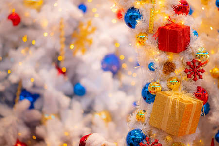 Christmas background  decoration with lighting and gift box ,Focus on foregroundの写真素材