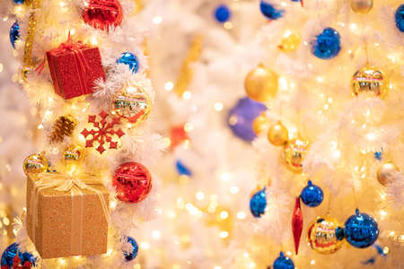 Christmas background  decoration with lighting and gift box ,Focus on foregroundの写真素材