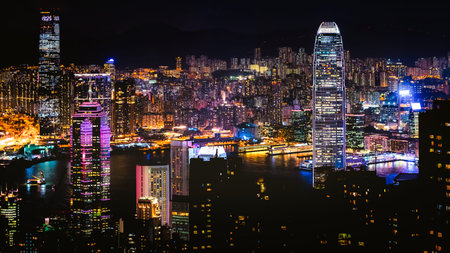 Night scene of skyscraper cityscape with many colorful vibrant color of lighting