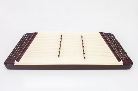Thai classical music instrument Khim 7 frets on white backgroundの写真素材