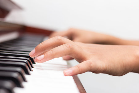 Children playing piano in the music room