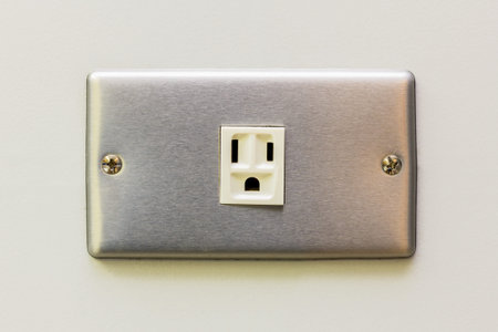 The stainless socket on the white wall