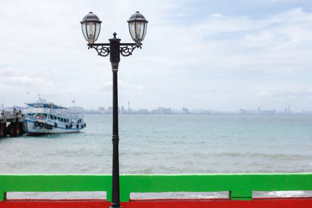 The Lamp post stand by the seaの写真素材