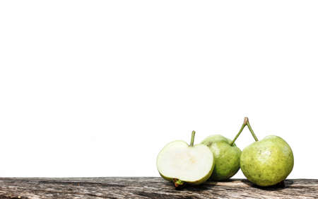 The guava on the log in a white backgroundの写真素材