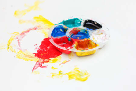 Watercolor and paintbrush on the tableの写真素材