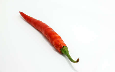 The red chilli on the white backgroundの写真素材