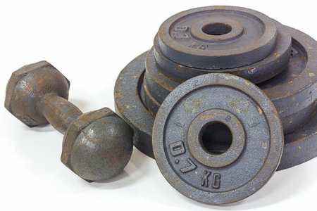 The old dumbbells on the white backgroundの写真素材