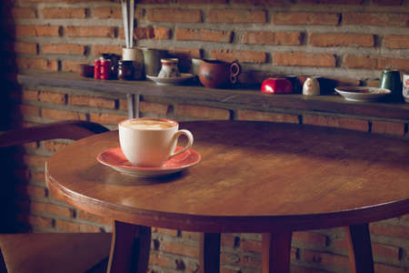 Coffee cup in coffee shop process vintage style picture, selective focusの写真素材