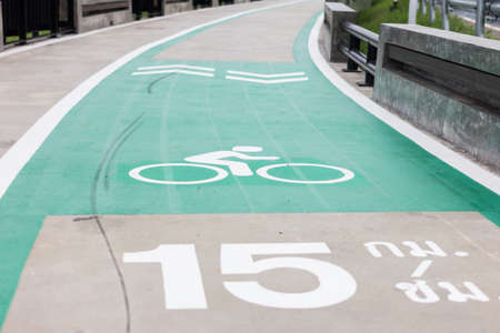 Bicycle lane with an arrow sign, select focusの写真素材