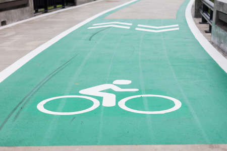Bicycle lane with an arrow sign, select focusの写真素材