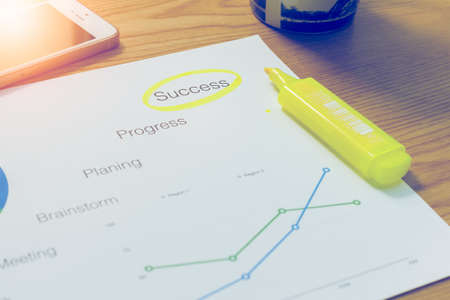 Highlighting at business document on the tableの写真素材