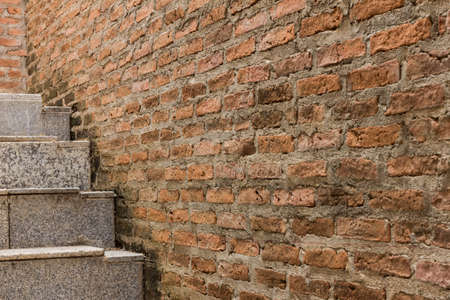 ladder on orange crack wall backgroundの写真素材