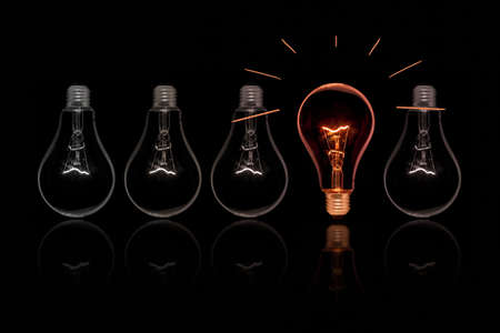 The old style Incandescent bulbs on black backgroundの写真素材