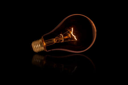The old style Incandescent bulbs on black backgroundの写真素材