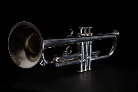 Silver trumpet isolated against a black backgroundの写真素材
