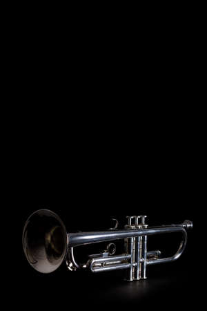 Silver trumpet isolated against a black backgroundの写真素材