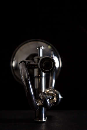 Silver trumpet isolated against a black backgroundの写真素材
